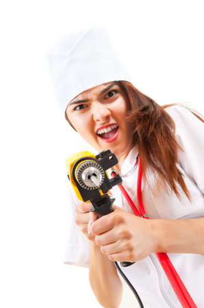 Mad nurse wants to drill a patient. Focus to drillの写真素材