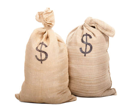 Two sacks full of dollars isolated on white backgroundの写真素材