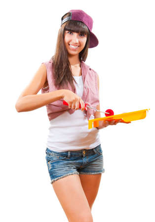 Beautiful young girl is going to paint somethingの写真素材