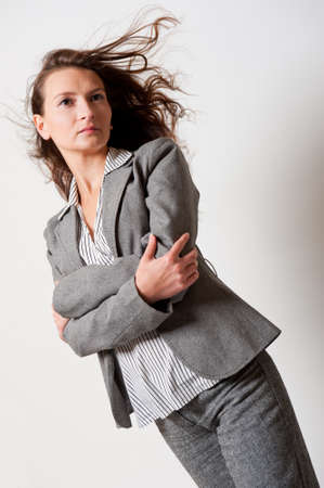 Young woman portrait with her hair flyingの写真素材