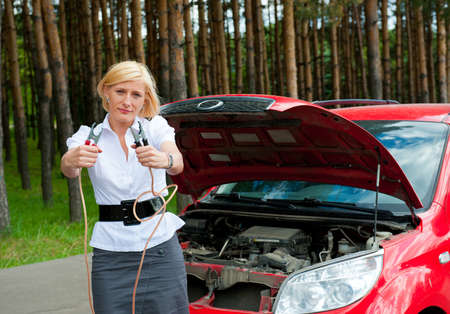 The girl asks for help charge the battery holding cleats