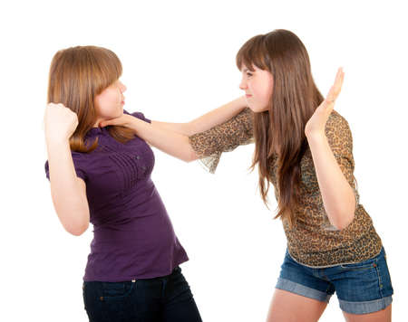 Fighting teen girls isolated over white background