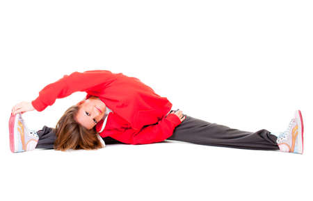 Young woman making stretching and sits on twine