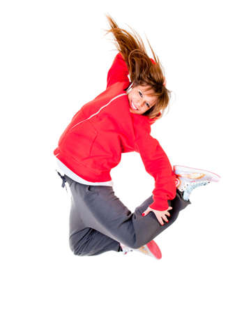 Slim athletic girl jumping isolated over whiteの写真素材