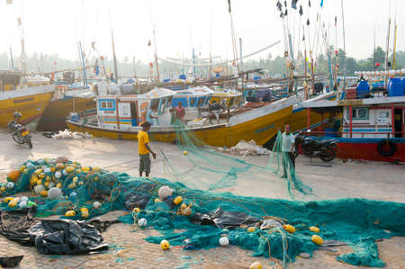 MIRISSA, SRI LANKA - APRIL 10: Fishermen returned to their work in Mirissa, Sri Lanka on April 10, 2012. In 2008 USAID finalize a $12.7 million repair of fishing harbor affected by tsunami in Mirissa.のeditorial素材