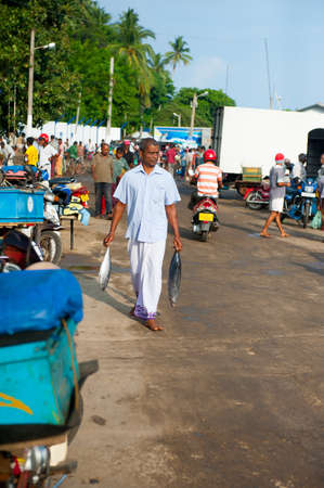 MIRISSA, SRI LANKA - APRIL 10: Fishermen returned to their work in Mirissa, Sri Lanka on April 10, 2012. In 2008 USAID finalize a $12.7 million repair of fishing harbor affected by tsunami in Mirissa.のeditorial素材