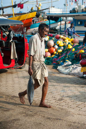 MIRISSA, SRI LANKA - APRIL 10: Fishermen returned to their work in Mirissa, Sri Lanka on April 10, 2012. In 2008 USAID finalize a $12.7 million repair of fishing harbor affected by tsunami in Mirissa.のeditorial素材