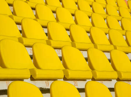 Yellow empty stadium seatsの写真素材