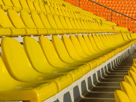 Yellow empty stadium seatsの写真素材