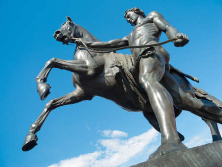 Saint-Petersburg sculpture: The Horse Tamers, designed by the Russian sculptor, Baron Peter Klodt von Urgensburg. Anichkov bridge, Saint-Petersburg, Russiaの写真素材