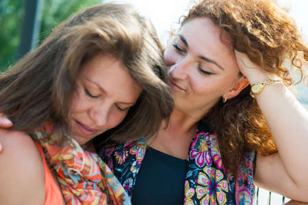 Portrait of two happy young beautiful womenの写真素材