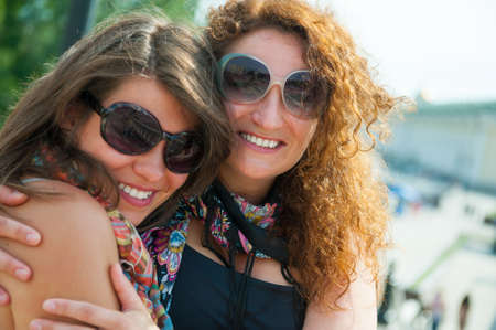 Portrait of two happy young beautiful womenの写真素材