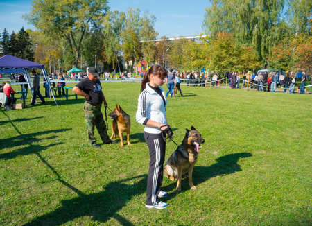 SUMY, UKRAINE - OCTOBER 7: Unidentified participants compete in dog show on October 10, 2012 in Sumy, Ukraine. Dog shows are held in Sumy twice a year and are very popular among the locals.のeditorial素材