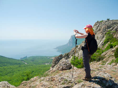 Hiker take a picture on a natureの写真素材