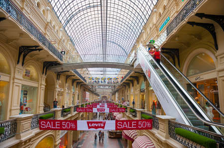 MOSCOW - JULY 18: Unidentified people visit famous GUM department store on July 18, 2012 in Moscow on Red Square. There are about 200 stores, and it is very popular for international tourists.のeditorial素材