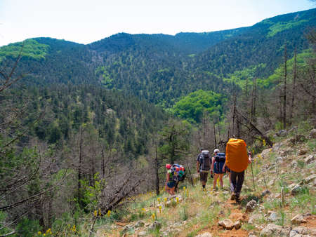Young people hikes in Crimea mountainsの写真素材