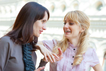 Two young women talking