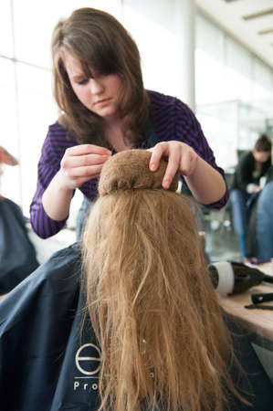 MOSCOW - APRIL 19: Unidentified orphan children, age 13-16, compete in hairdressing at the contest Young Master on April 19, 2013 in Moscow. Orphans were trained by charitable foundation Color of Lifeのeditorial素材
