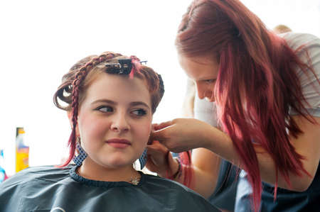 MOSCOW - APRIL 19: Unidentified orphan children, age 13-16, compete in hairdressing at the contest Young Master on April 19, 2013 in Moscow. Orphans were trained by charitable foundation Color of Lifeのeditorial素材