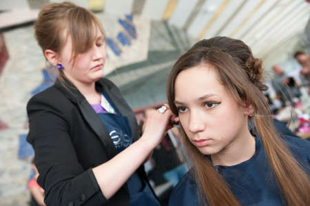 MOSCOW - APRIL 19: Unidentified orphan children, age 13-16, compete in hairdressing at the contest Young Master on April 19, 2013 in Moscow. Orphans were trained by charitable foundation Color of Lifeのeditorial素材