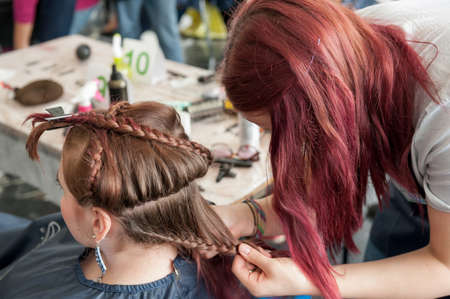 MOSCOW - APRIL 19: Unidentified orphan children, age 13-16, compete in hairdressing at the contest Young Master on April 19, 2013 in Moscow. Orphans were trained by charitable foundation Color of Lifeのeditorial素材