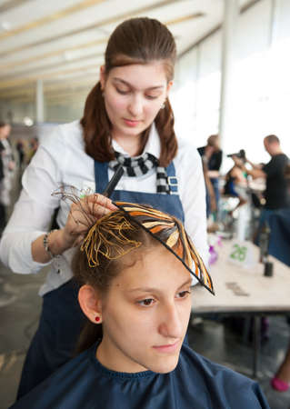 MOSCOW - APRIL 19: Unidentified orphan children, age 13-16, compete in hairdressing at the contest...