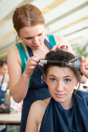 MOSCOW - APRIL 19: Unidentified orphan children, age 13-16, compete in hairdressing at the contest Young Master on April 19, 2013 in Moscow. Orphans were trained by charitable foundation Color of Lifeのeditorial素材