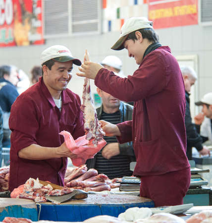 MOSCOW - MAY 18: Unidentified butchers working in the Dorogomilovsky agricultural market on May 18,...