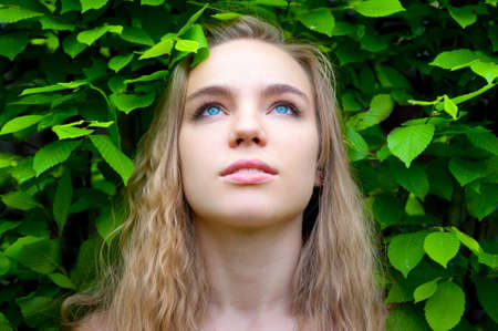 Portrait of young woman in the parkの写真素材