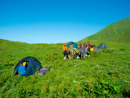 Hikers eat breakfast at the camp in the mountains, Svaneti, Georgiaの写真素材