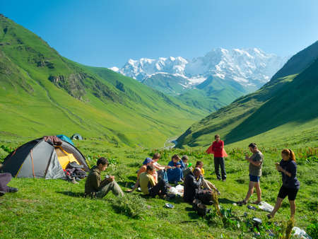 Hikers eat breakfast at the camp in the mountains, Svaneti, Georgiaの写真素材