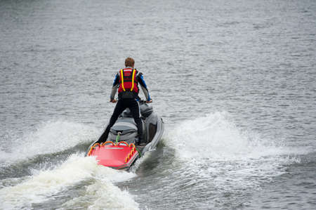 MOSCOW - JULY 28: Rescuer work on Red Bull Flugtag on July 28, 2013 in Moscow. Red Bull Flugtag is an event in which competitors attempt to fly homemade human-powered flying machinesのeditorial素材