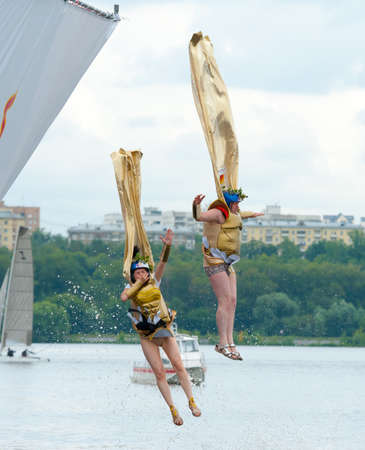 MOSCOW - JULY 28: Competitors jump to water on Red Bull Flugtag on July 28, 2013 in Moscow. Red Bull Flugtag is an event in which competitors attempt to fly homemade human-powered flying machinesのeditorial素材