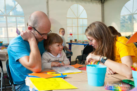 MOSCOW - SEPTEMBER 7: Animator entertains unidentified child on playground at Usadba Jazz Festival on September 7, 2013 in Moscow. This festival was held on the Day of Moscow and was free to visitのeditorial素材