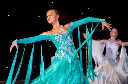 Female dancer performs at dance championship. Slow waltz dance.