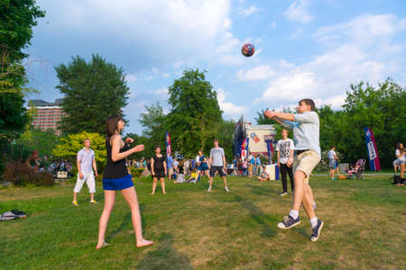 MOSCOW - MAY 24: People have fun playing volley ball at Bosco Fresh Festival in Muzeon Park on May 24, 2014 in Moscowのeditorial素材