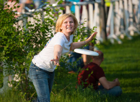 MOSCOW - MAY 24: Woman plays frisbee at Bosco Fresh Festival in Muzeon Park on May 24, 2014 in Moscowのeditorial素材