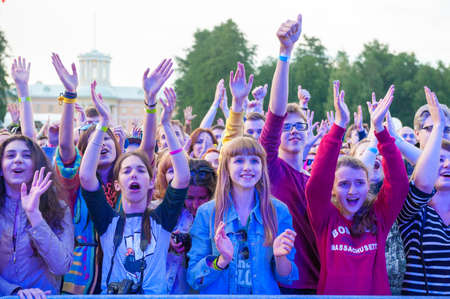 MOSCOW - JUNE 14: People cheering at open-air concert on XI International Jazz Festival "Usadba Jazz" in Archangelskoye Museum-Mansion on June 14, 2014 in Moscowのeditorial素材