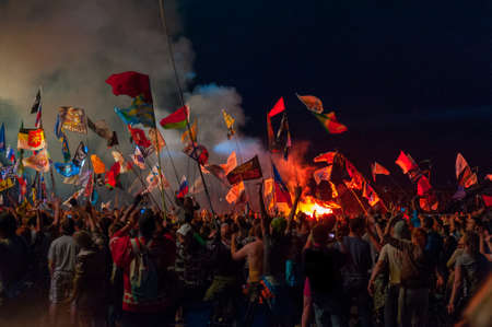 BIG ZAVIDOVO, RUSSIA - JULY 4: People cheering at open-air rock festival "Nashestvie" on July 4, 2014 in Big Zavidovo, Russia. "Nashestvie" is the biggest rock festival in Russia, more 200000 visitorsのeditorial素材