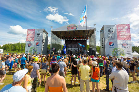 BIG ZAVIDOVO, RUSSIA - JULY 4: People attend open-air rock festival "Nashestvie" on July 4, 2014 in Big Zavidovo, Russia. "Nashestvie" is the biggest rock festival in Russia, more than 200000 visitorsのeditorial素材