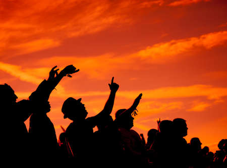 BIG ZAVIDOVO, RUSSIA - JULY 5: People cheering at open-air rock festival "Nashestvie" on July 5, 2014 in Big Zavidovo, Russia. "Nashestvie" is the biggest rock festival in Russia, more 200000 visitorsのeditorial素材