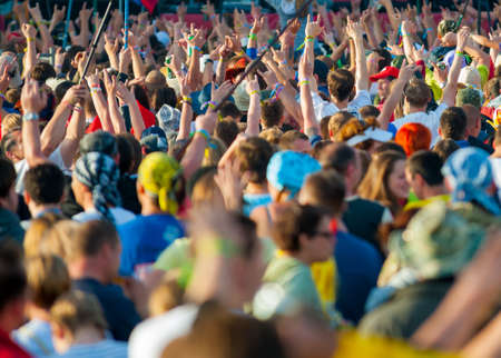 BIG ZAVIDOVO, RUSSIA - JULY 5: People cheering at open-air rock festival Nashestvie on July 5, 2014...