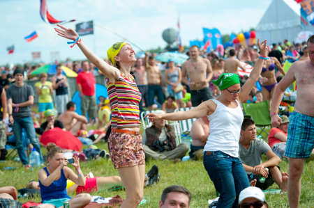 BIG ZAVIDOVO, RUSSIA - JULY 5: People attend open-air rock festival "Nashestvie" on July 5, 2014 in Big Zavidovo, Russia. "Nashestvie" is the biggest rock festival in Russia, more than 200000 visitorsのeditorial素材