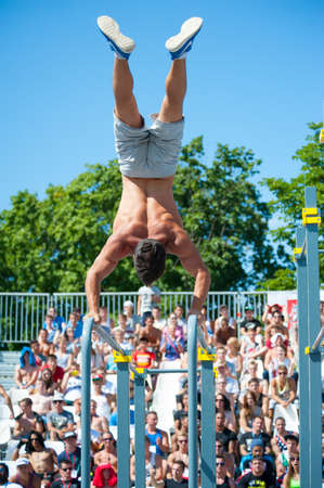 MOSCOW - JULY 26: Unidentified athlete performs during the street workout championship at Moscow City Games in Luzhniki on July 26, 2014 in Moscow.のeditorial素材