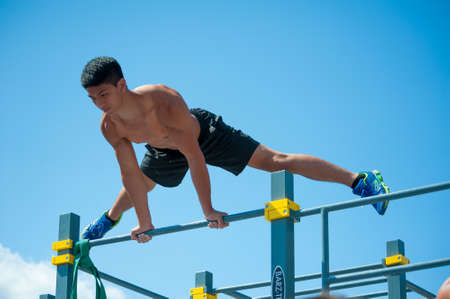 MOSCOW - JULY 26: Unidentified athlete performs during the street workout championship at Moscow City Games in Luzhniki on July 26, 2014 in Moscow.のeditorial素材