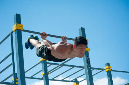 MOSCOW - JULY 26: Unidentified athlete performs during the street workout championship at Moscow...