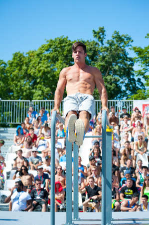 MOSCOW - JULY 26: Unidentified athlete performs during the street workout championship at Moscow City Games in Luzhniki on July 26, 2014 in Moscow.のeditorial素材