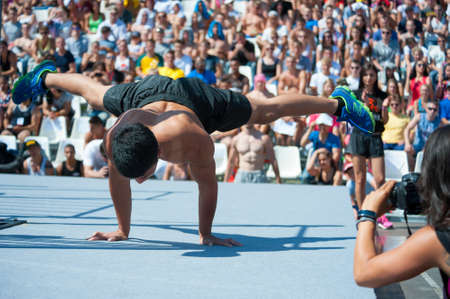 MOSCOW - JULY 26: Unidentified athlete performs during the street workout championship at Moscow City Games in Luzhniki on July 26, 2014 in Moscow.のeditorial素材