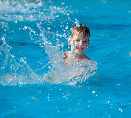 MOSCOW - JULY 26: Unidentified boy age 6-8 years plays in the pool during Moscow City Games in Luzhniki on July 26, 2014 in Moscow.のeditorial素材
