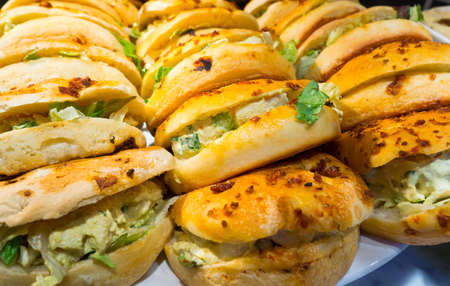 Hamburgers are stacked in fast food restaurant